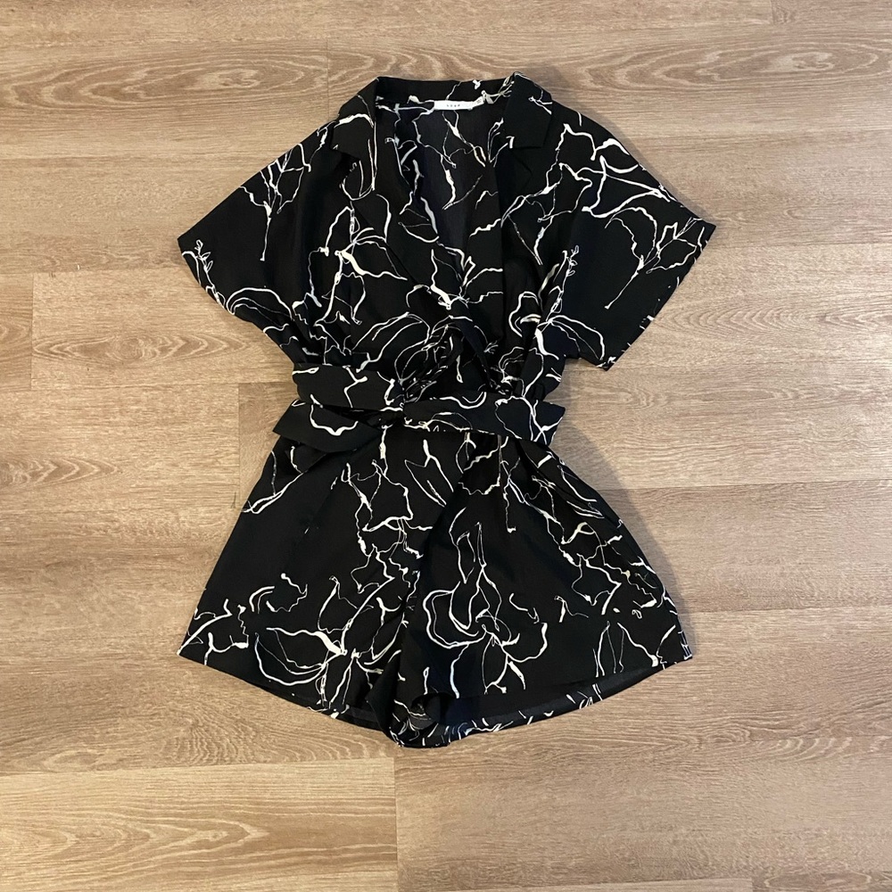 Black romper, never worn, size small